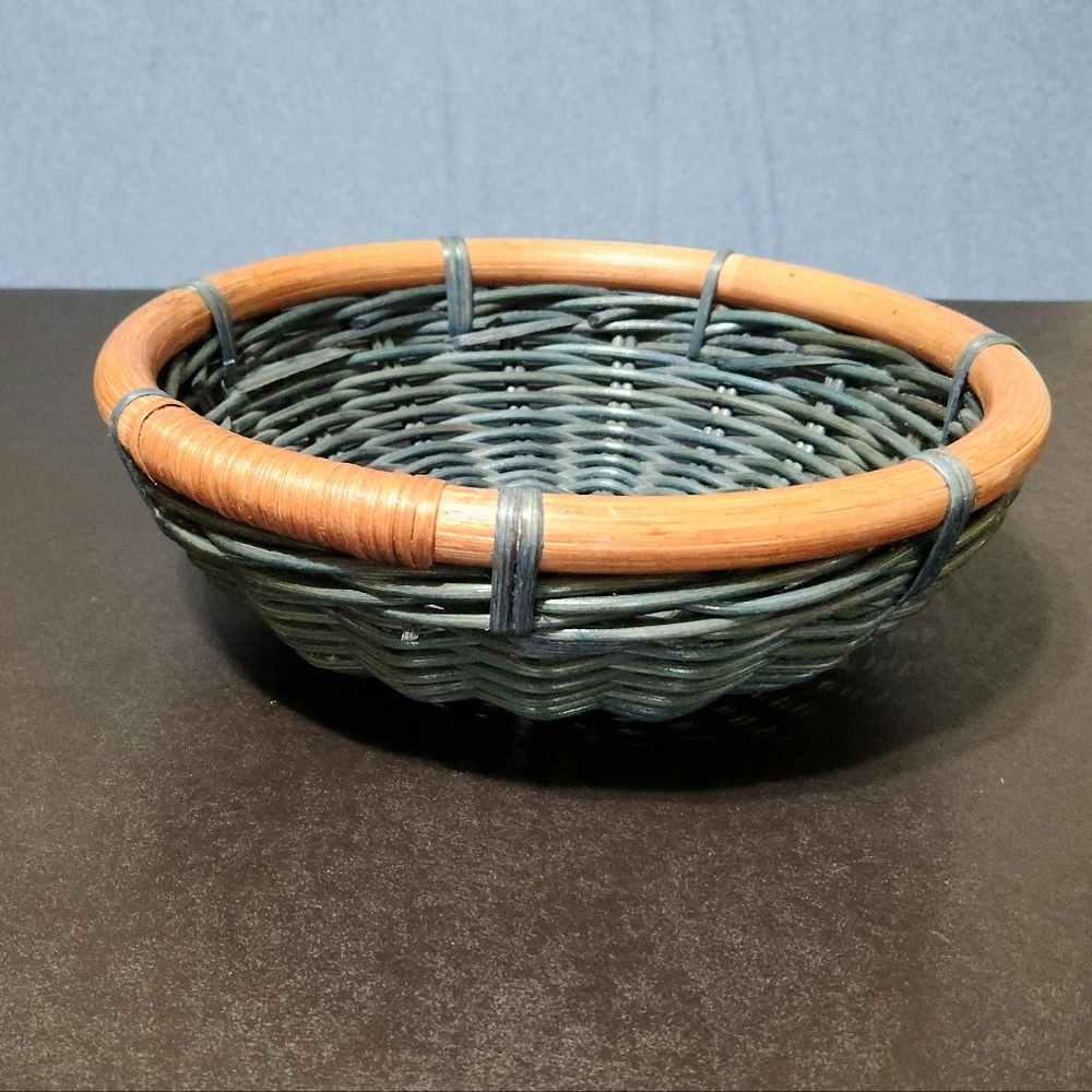 Woven blue wicker basket with wooden rim